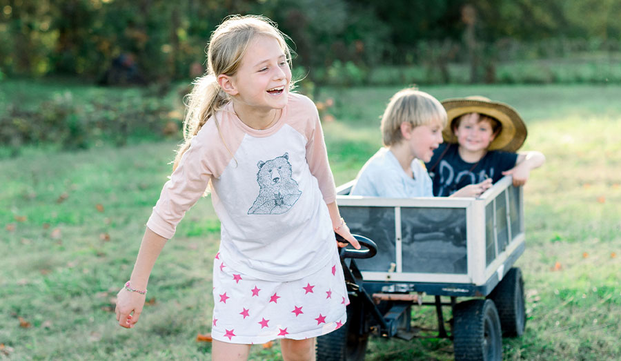 Kids being pulled in a wagon